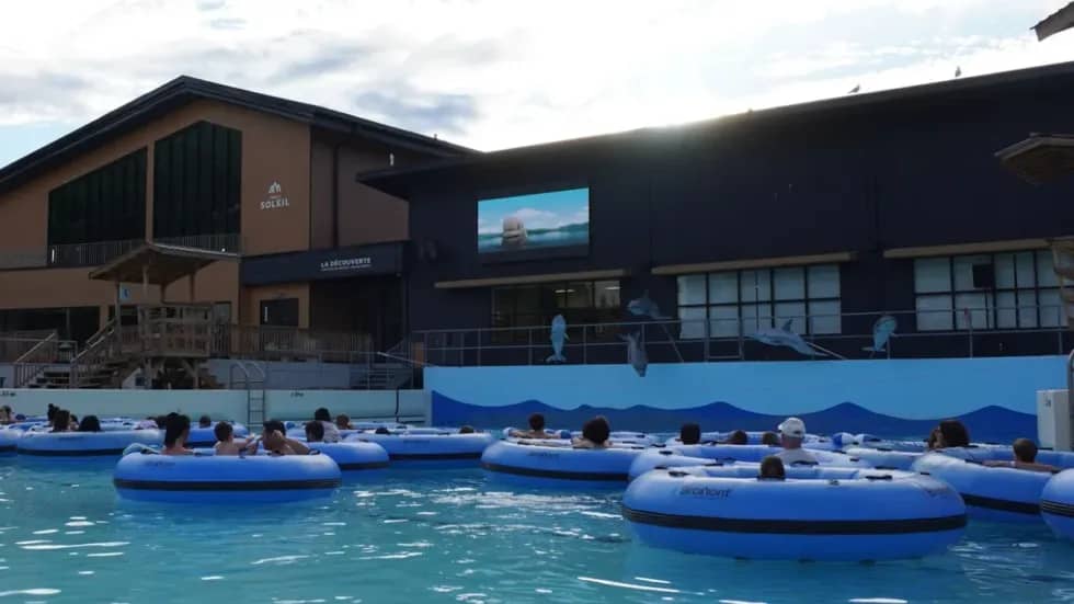 You can watch movies while floating in a wave pool near montreal this summer