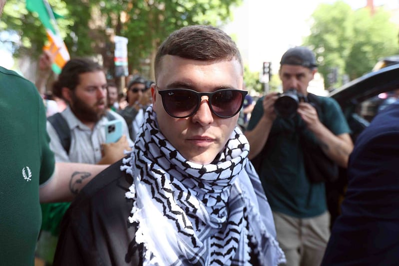 Kneecap’s mo chara granted bail in first court appearance on terror charge